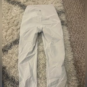 Lululemon white leggings with design at the bottom of the pants